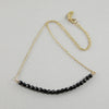 black and gold necklace